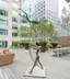 Contemporary sculpture restoration - abstract bronze figures installed in urban outdoor setting