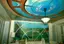 Residential ceiling mural restoration - dramatic sky and landscape painting with geometric architectural elements and custom lighting integration